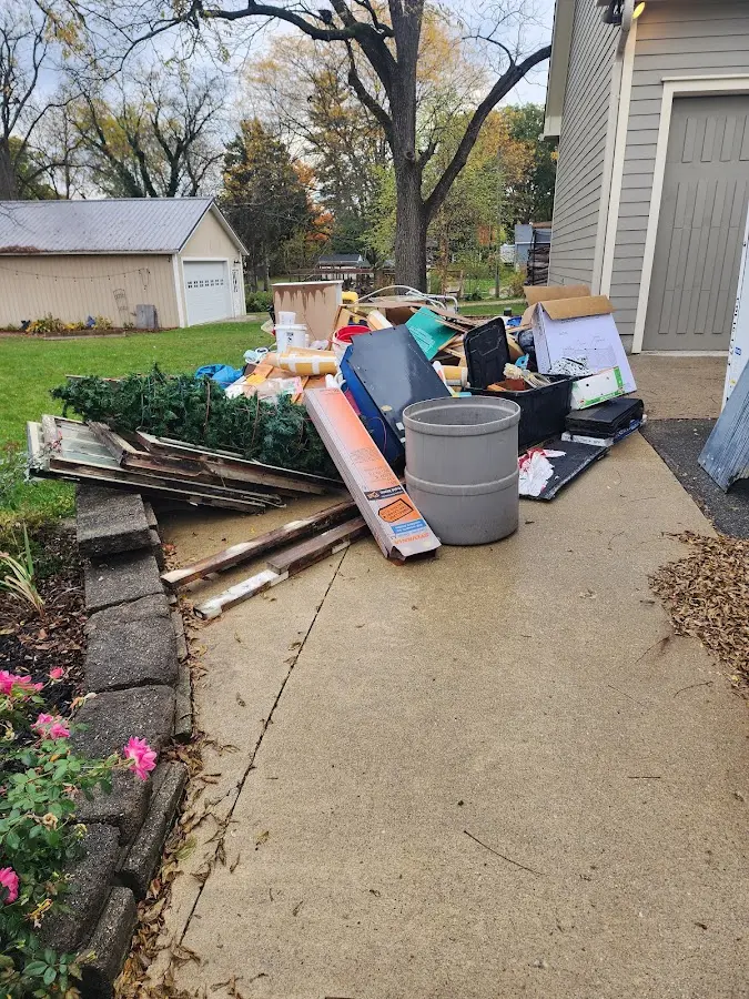 Dumpster being loaded with debris for 10 Yard Dumpster Rental in Ferndale